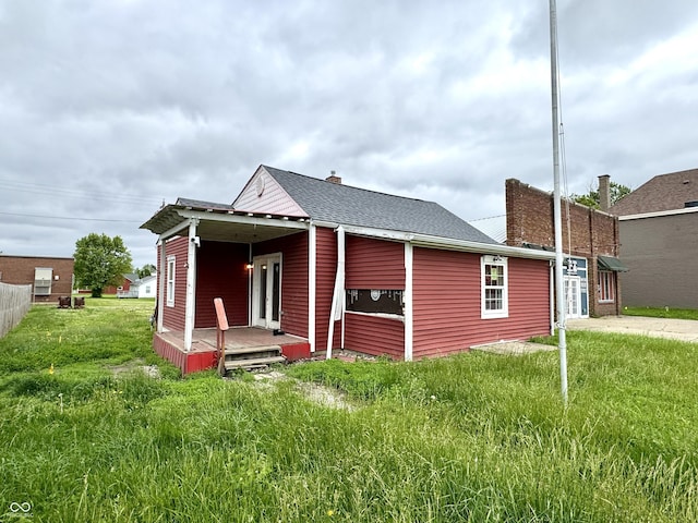 104 W Pearl St, Trafalgar, IN 46181 - back of house with a chimney and a yard