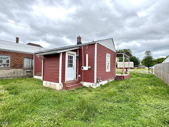 104 W Pearl St, Trafalgar, IN 46181 - back of house with entry steps and a chimney