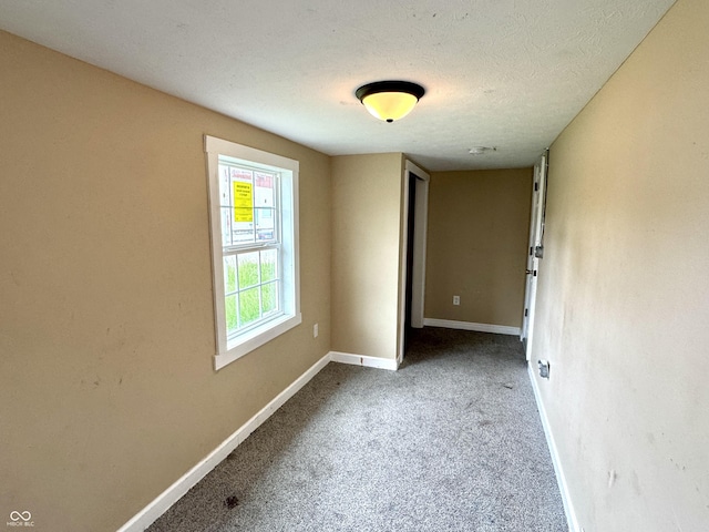 104 W Pearl St, Trafalgar, IN 46181 - carpeted spare room with baseboards and a textured ceiling