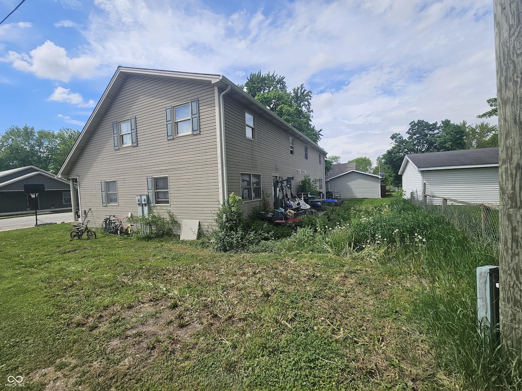 120 N Elm St, Thorntown, IN 46071 - view of home's exterior featuring a lawn