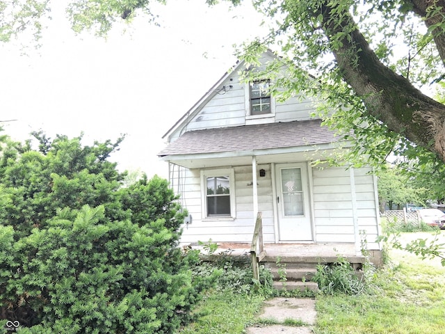 314 N 30th St, New Castle, IN 47362 - view of front of property featuring roof with shingles and a porch