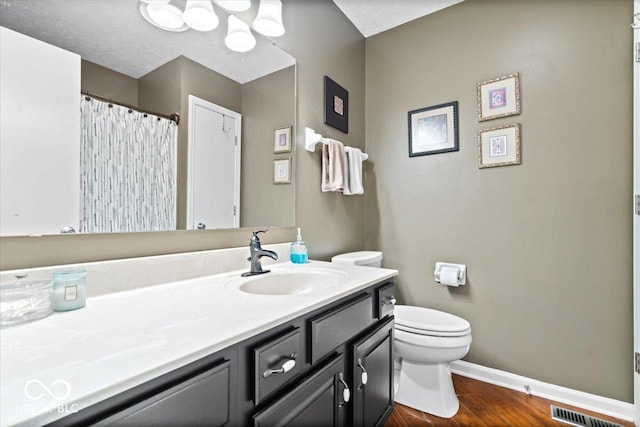 11041 Limbach Cir, Indianapolis, IN 46236 - bathroom featuring toilet, vanity, baseboards, and wood finished floors