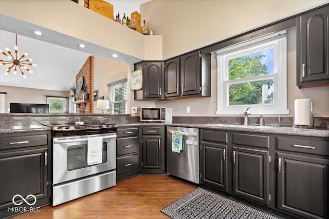 11041 Limbach Cir, Indianapolis, IN 46236 - kitchen with appliances with stainless steel finishes, a sink, dark wood-style flooring, a chandelier, and lofted ceiling