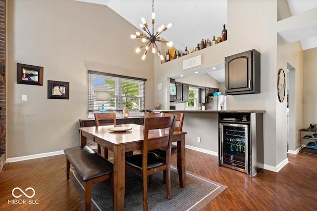11041 Limbach Cir, Indianapolis, IN 46236 - dining space with beverage cooler, dark wood-style floors, a chandelier, baseboards, and high vaulted ceiling