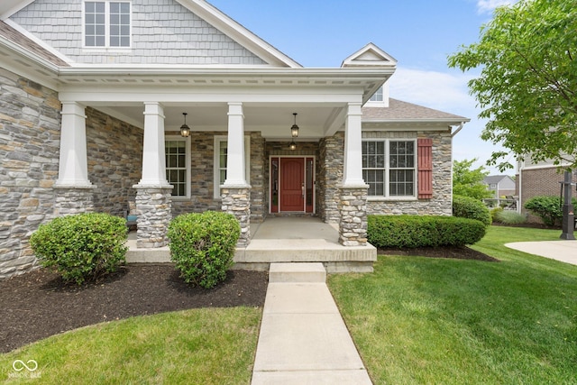 15292 Slateford Rd, Noblesville, IN 46062 - view of front facade featuring stone siding, a front yard, and covered porch