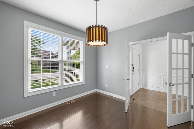 15292 Slateford Rd, Noblesville, IN 46062 - unfurnished dining area with dark wood-type flooring and baseboards