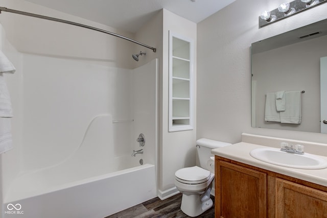 8684 Captain Dr, Avon, IN 46123 - full bath featuring wood finished floors, vanity, toilet, and washtub / shower combination