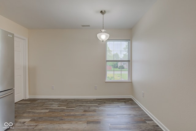 8684 Captain Dr, Avon, IN 46123 - unfurnished dining area with wood finished floors and baseboards