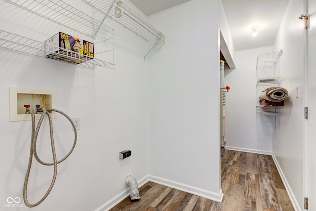 8684 Captain Dr, Avon, IN 46123 - laundry area featuring hookup for a washing machine, electric dryer hookup, wood finished floors, and baseboards