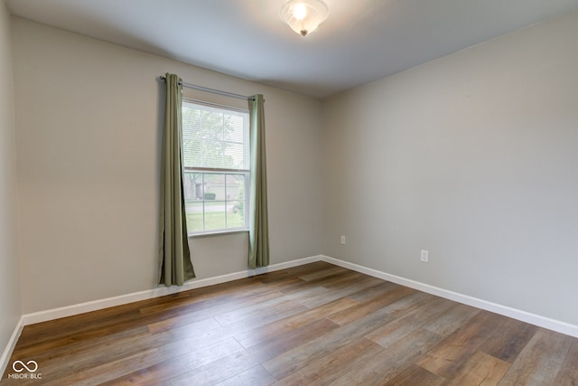 8684 Captain Dr, Avon, IN 46123 - empty room featuring wood finished floors and baseboards