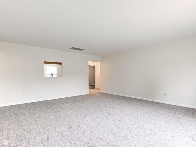 8684 Captain Dr, Avon, IN 46123 - spare room featuring light carpet and baseboards