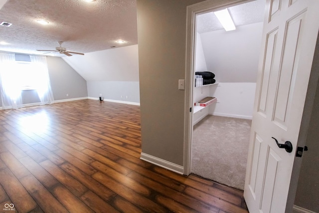 7093 Republic Ln, Indianapolis, IN 46259 - additional living space with ceiling fan, a textured ceiling, lofted ceiling, hardwood / wood-style flooring, and baseboards