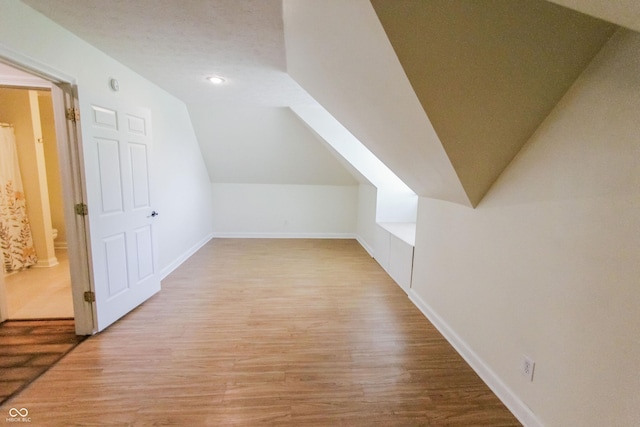 7093 Republic Ln, Indianapolis, IN 46259 - additional living space featuring lofted ceiling, wood finished floors, baseboards, and recessed lighting