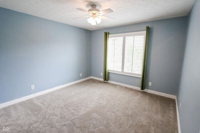 7093 Republic Ln, Indianapolis, IN 46259 - empty room featuring carpet, a ceiling fan, baseboards, and a textured ceiling
