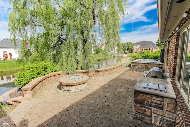 7093 Republic Ln, Indianapolis, IN 46259 - view of patio / terrace with a fire pit and a water view