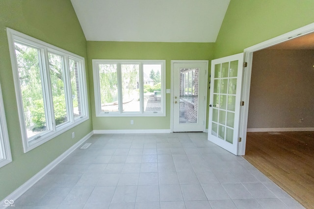 7093 Republic Ln, Indianapolis, IN 46259 - unfurnished sunroom with vaulted ceiling, tile patterned flooring, and baseboards