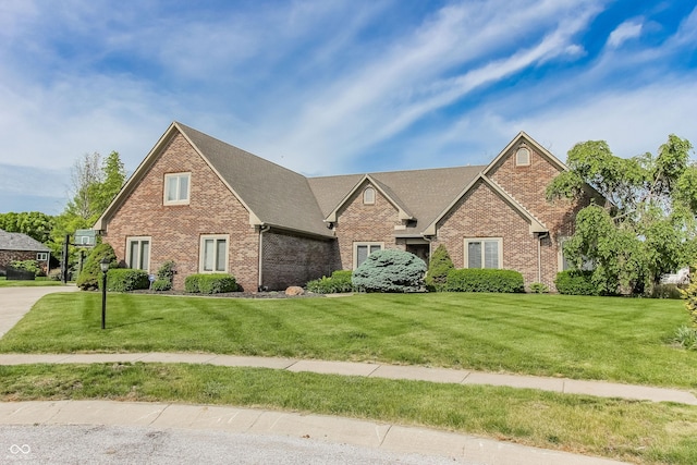 7093 Republic Ln, Indianapolis, IN 46259 - view of front of house with brick siding, a front lawn, and roof with shingles