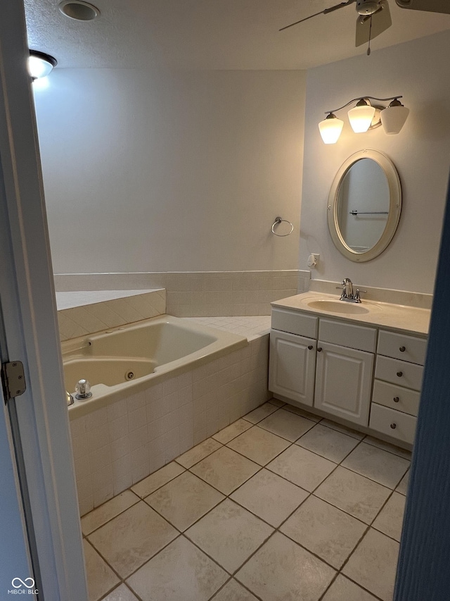 213 Golf Ct, Greenwood, IN 46143 - full bath with a tub with jets, tile patterned flooring, vanity, and ceiling fan