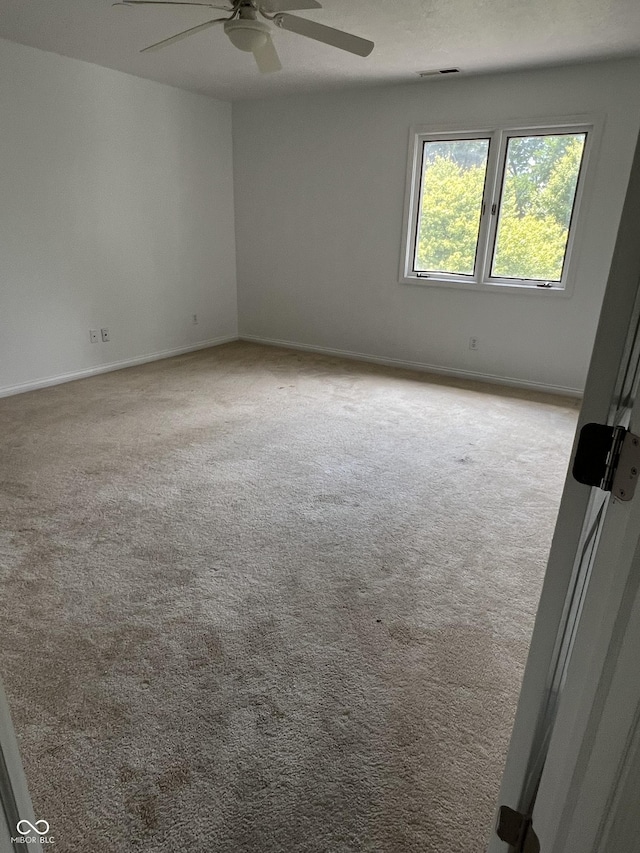 213 Golf Ct, Greenwood, IN 46143 - empty room featuring carpet floors and a ceiling fan
