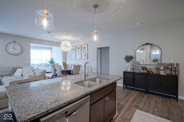19144 Goins Blvd, Westfield, IN 46074 - kitchen featuring a sink, dishwasher, dark wood finished floors, a kitchen island with sink, and stone countertops