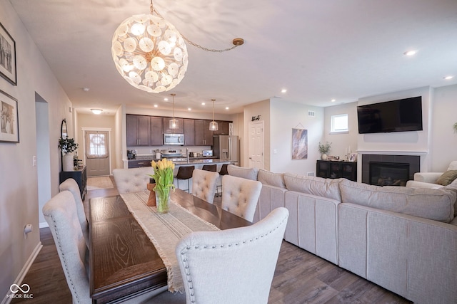 19144 Goins Blvd, Westfield, IN 46074 - dining area featuring recessed lighting, dark wood-type flooring, plenty of natural light, a fireplace, and baseboards