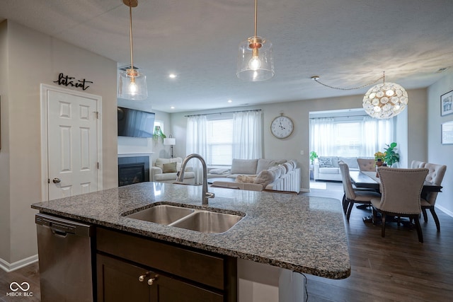 19144 Goins Blvd, Westfield, IN 46074 - kitchen with dishwasher, a sink, open floor plan, a center island with sink, and dark wood-style floors