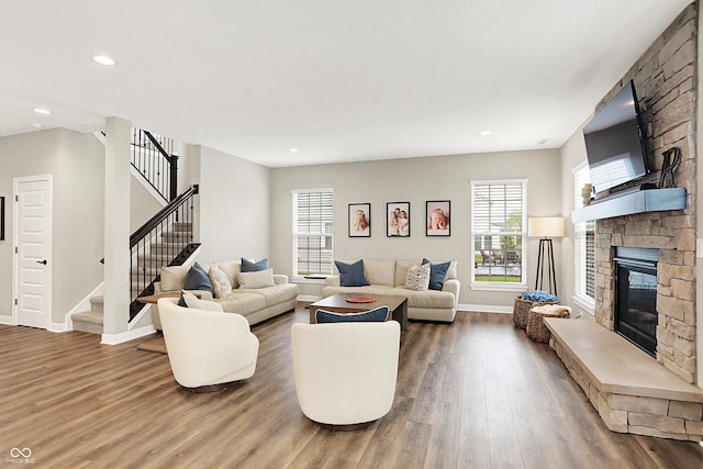 4602 Hayward Way, Westfield, IN 46062 - living room with wood finished floors, a fireplace, baseboards, stairs, and recessed lighting