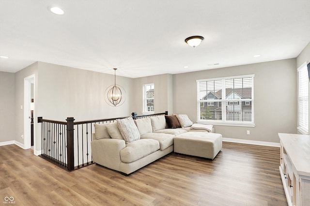 4602 Hayward Way, Westfield, IN 46062 - living area featuring a chandelier, plenty of natural light, light wood finished floors, baseboards, and recessed lighting