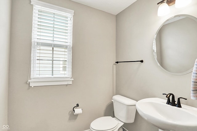 4602 Hayward Way, Westfield, IN 46062 - bathroom with a sink, healthy amount of natural light, toilet, and baseboards