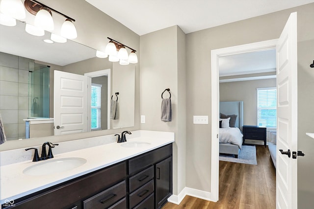 4602 Hayward Way, Westfield, IN 46062 - full bath with wood finished floors, double vanity, baseboards, connected bathroom, and tiled shower