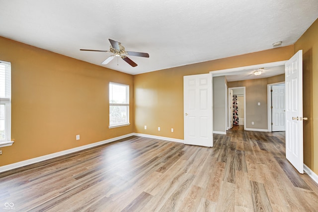 1306 Flat Wood Ct, Brownsburg, IN 46112 - empty room with a ceiling fan, wood finished floors, and a smoke detector