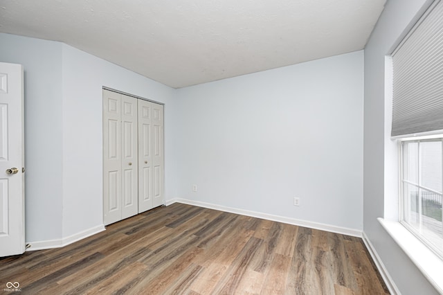 1306 Flat Wood Ct, Brownsburg, IN 46112 - unfurnished bedroom with wood finished floors and a closet