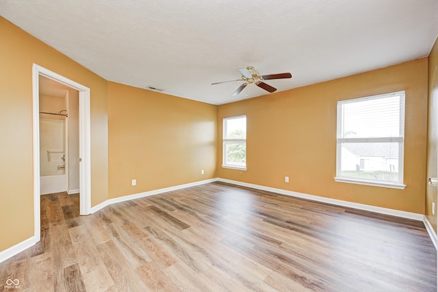 1306 Flat Wood Ct, Brownsburg, IN 46112 - unfurnished room with light wood finished floors and ceiling fan