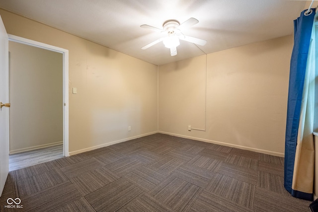 6 Heritage Dr, Terre Haute, IN 47803 - unfurnished room with ceiling fan, dark colored carpet, and baseboards