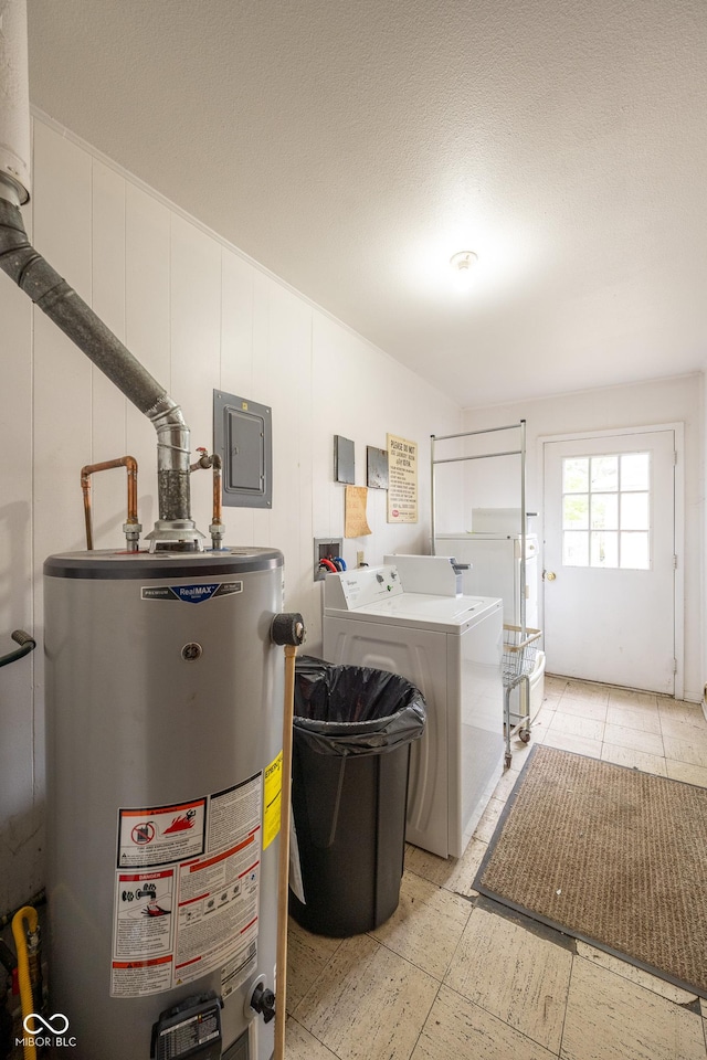 6 Heritage Dr, Terre Haute, IN 47803 - laundry room featuring gas water heater, washer and dryer, light floors, and electric panel