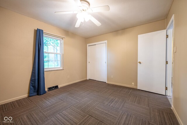 6 Heritage Dr, Terre Haute, IN 47803 - unfurnished bedroom featuring carpet, baseboards, a ceiling fan, and a closet