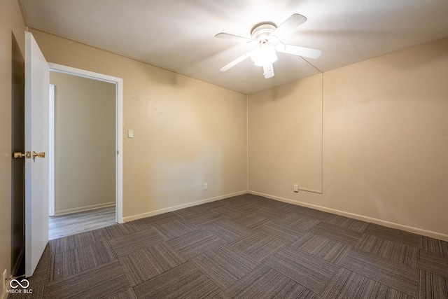 6 Heritage Dr, Terre Haute, IN 47803 - unfurnished room with ceiling fan, dark colored carpet, and baseboards