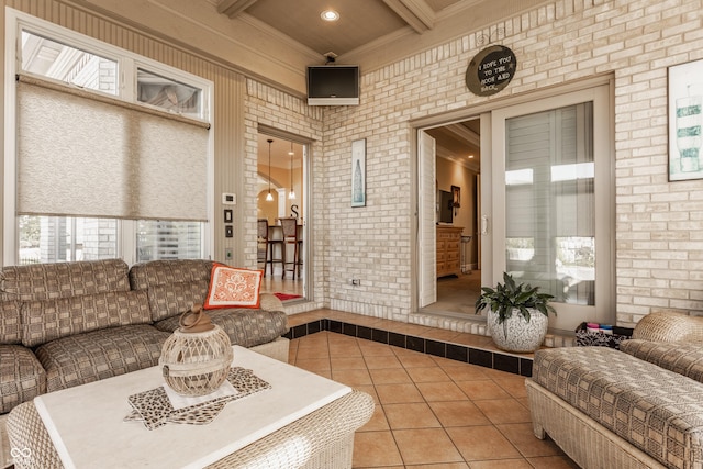 4930 Benthaven Dr E, Bargersville, IN 46106 - living area with tile patterned floors, crown molding, beam ceiling, brick wall, and recessed lighting