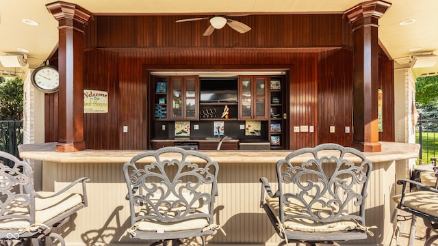 4930 Benthaven Dr E, Bargersville, IN 46106 - bar featuring wooden walls, ceiling fan, recessed lighting, and ornate columns