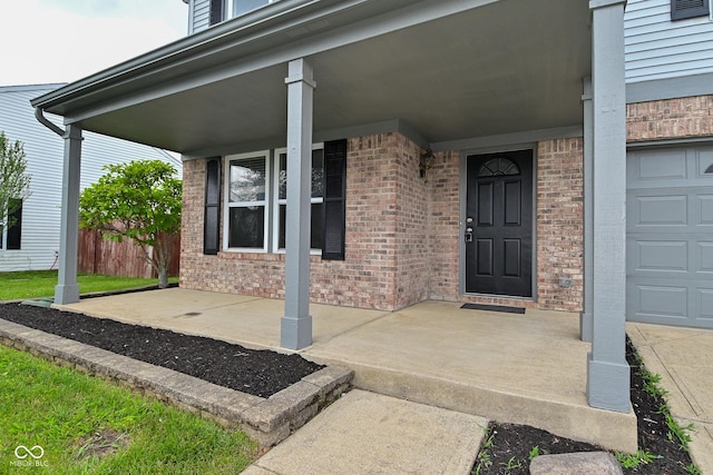 9206 Huntleigh Cir, Plainfield, IN 46168 - property entrance with brick siding, a porch, and a garage