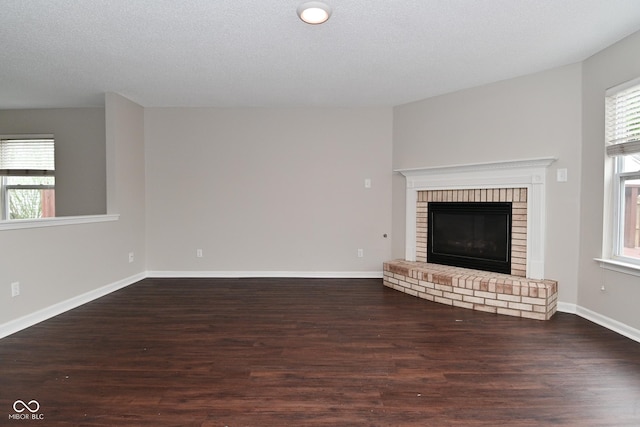 9206 Huntleigh Cir, Plainfield, IN 46168 - unfurnished living room featuring wood finished floors and a brick fireplace