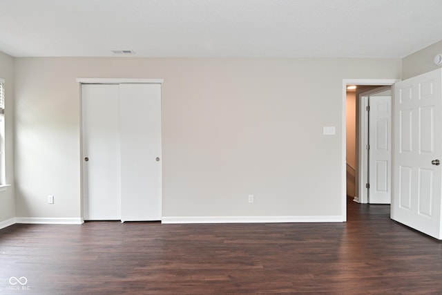 9206 Huntleigh Cir, Plainfield, IN 46168 - unfurnished bedroom featuring wood finished floors and a closet