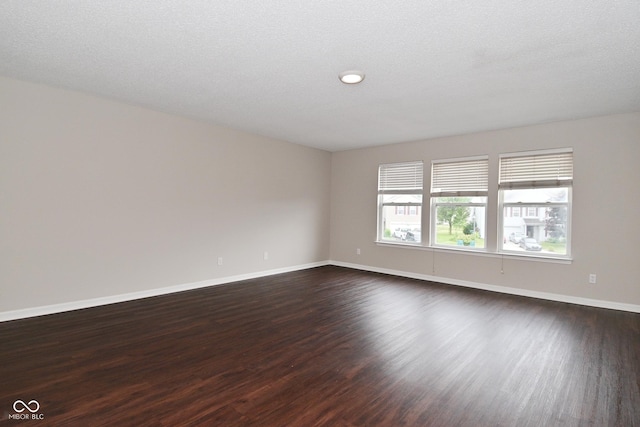9206 Huntleigh Cir, Plainfield, IN 46168 - empty room with dark wood finished floors and baseboards