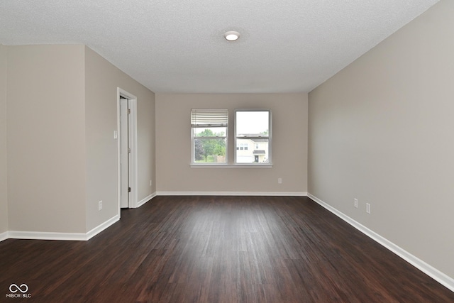 9206 Huntleigh Cir, Plainfield, IN 46168 - spare room featuring dark wood-style floors and a textured ceiling