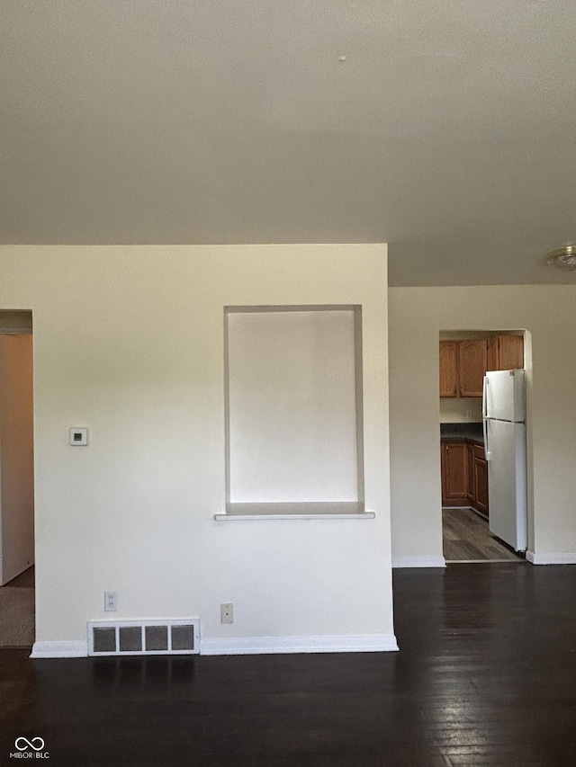 3031 W 18th St, Indianapolis, IN 46222 - spare room with baseboards and dark wood finished floors
