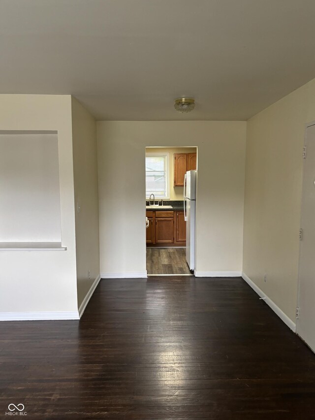 3031 W 18th St, Indianapolis, IN 46222 - empty room with baseboards and dark wood finished floors