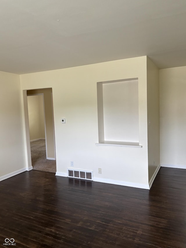 3031 W 18th St, Indianapolis, IN 46222 - empty room with dark wood-type flooring and baseboards