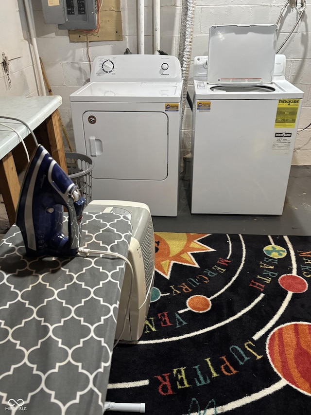 3031 W 18th St, Indianapolis, IN 46222 - washroom featuring washing machine and dryer, concrete block wall, and electric panel