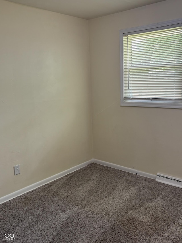 3031 W 18th St, Indianapolis, IN 46222 - empty room featuring carpet floors and baseboards
