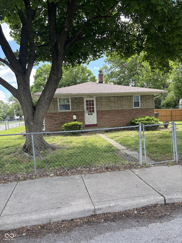 3031 W 18th St, Indianapolis, IN 46222 - view of front facade with a chimney and brick siding